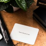 white printer paper beside black and white click pen