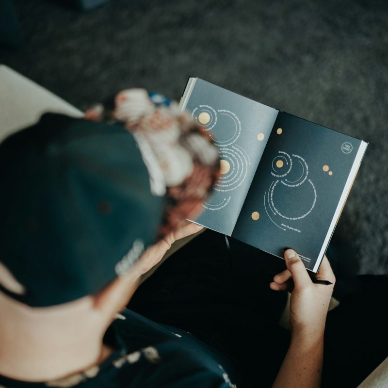 person holding white and black vinyl record